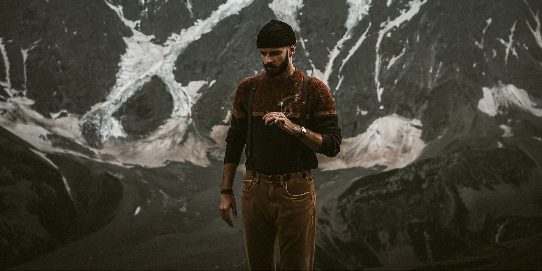 Man standing in front of mountain wearing Full Leather Wiseguy Original Suspenders 