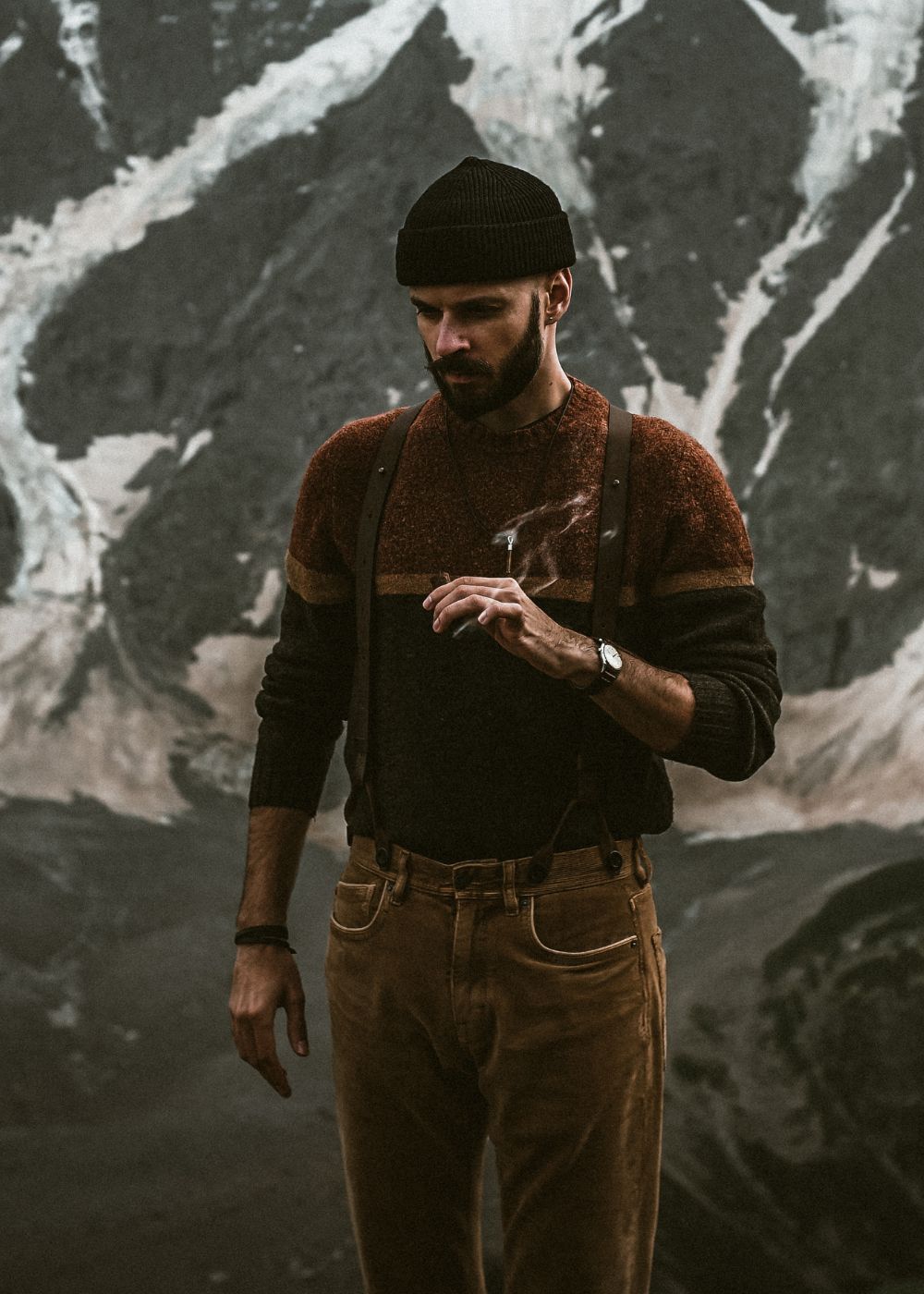 Man standing in front of mountain wearing Full Leather Wiseguy Original Suspenders 